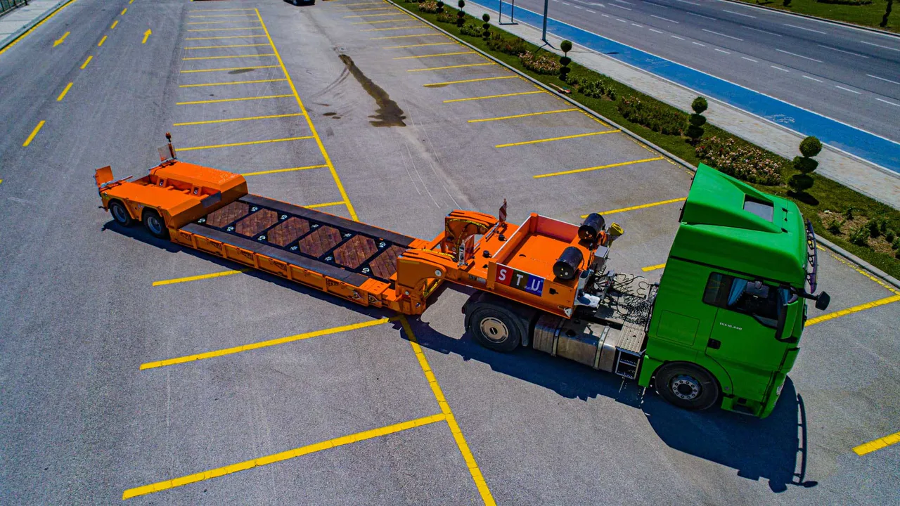Extendable low loader platform for long cargo and constrained transport projects. — STU Trailers